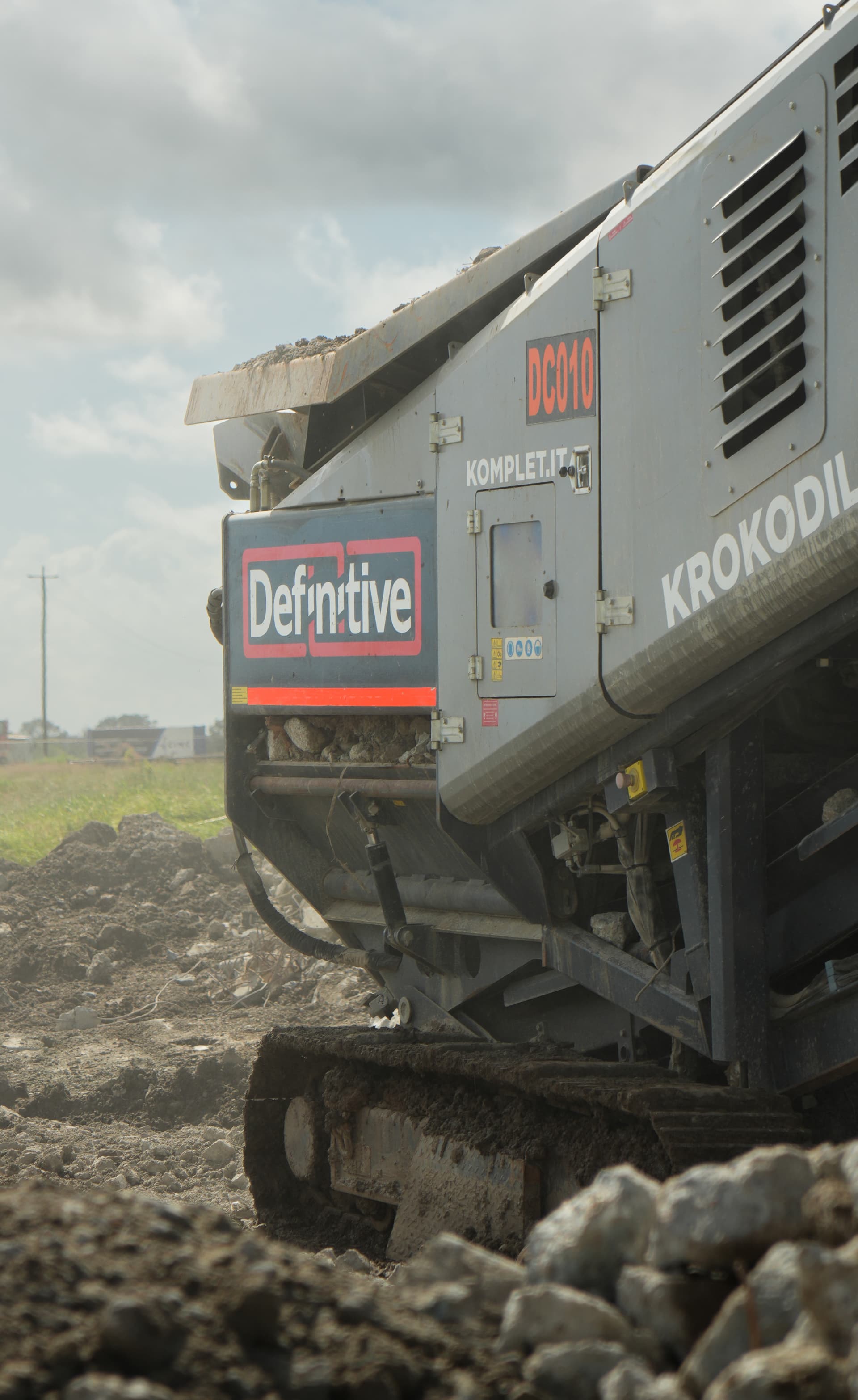 Definitive Contracting branded crusher onsite